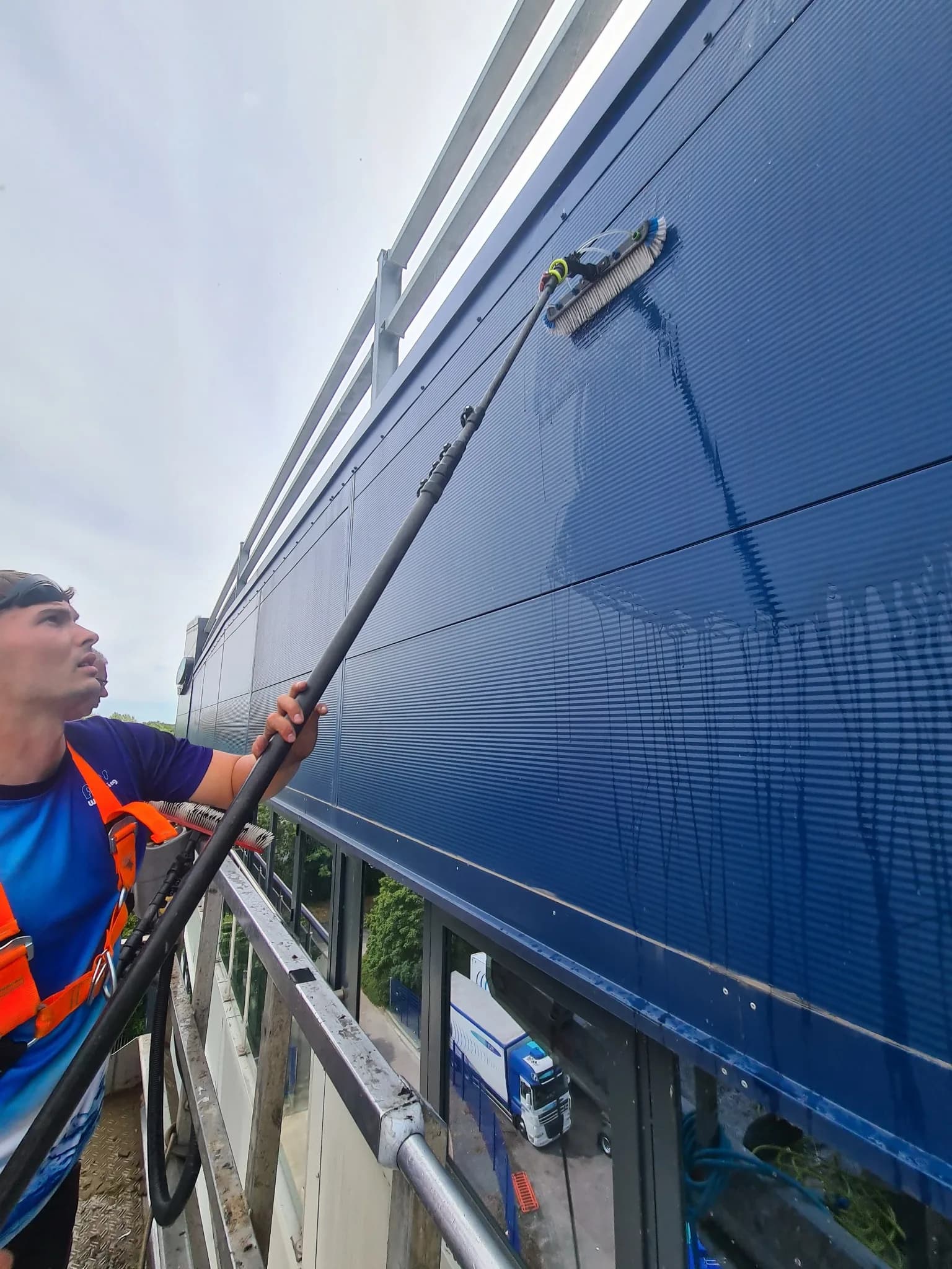 Blue metal cladding panels cleaned from a MEWP cherry picker