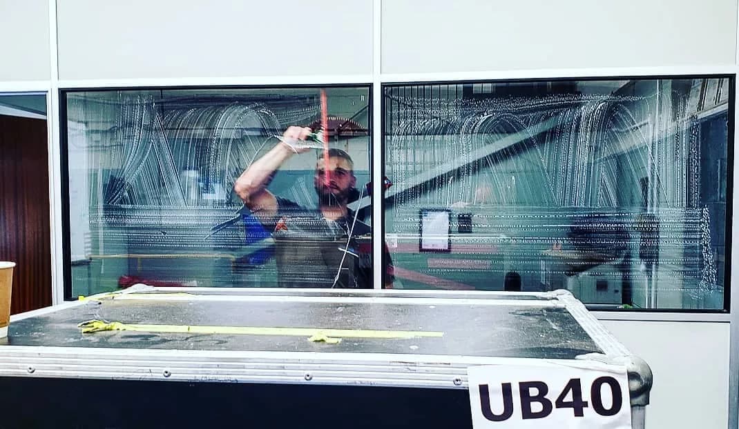 Commercial office interior glass partition being cleaned