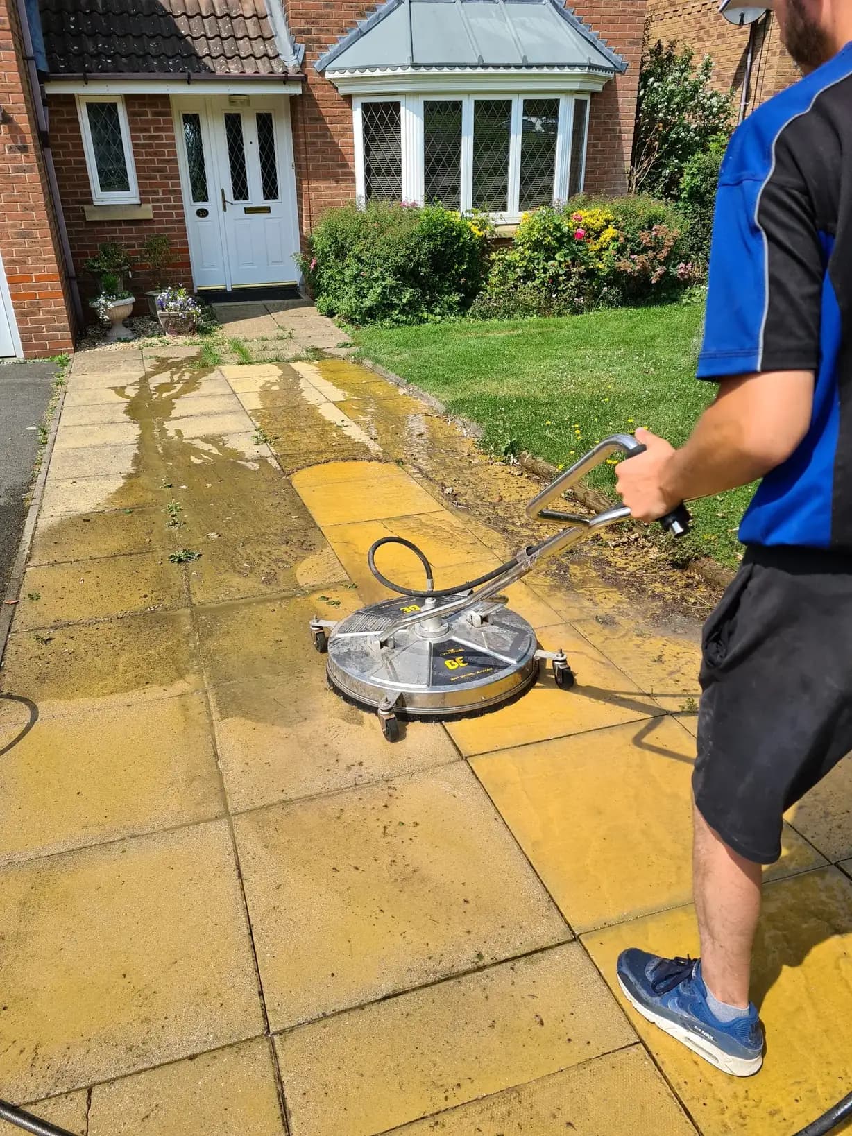 Patio pressure washing in progress