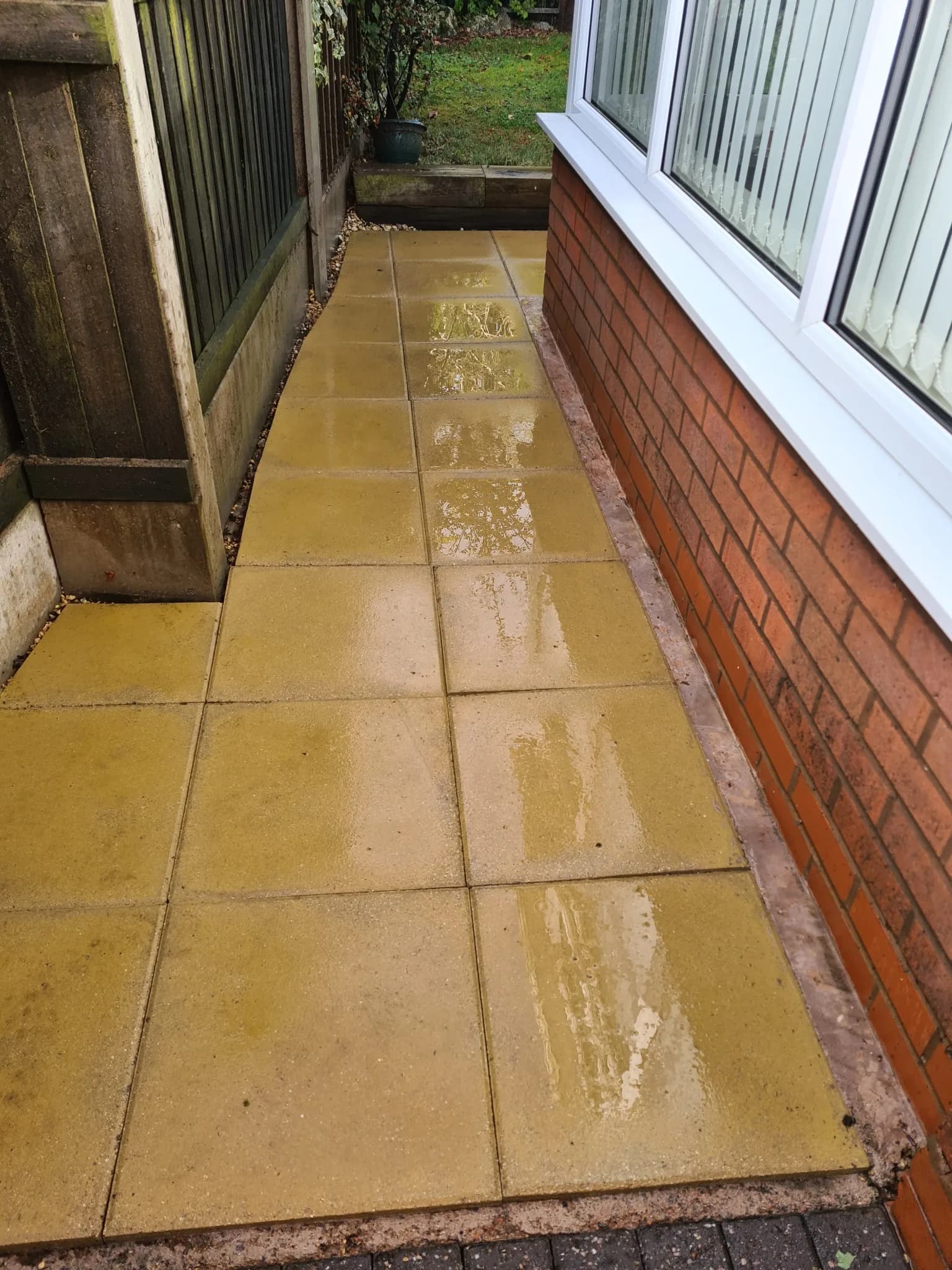 Paved side path after pressure washing, clean and restored